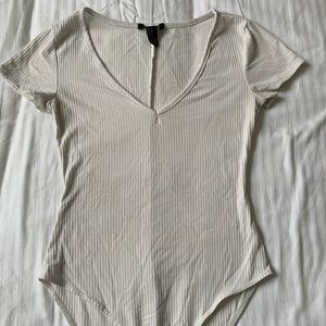 Off white colored body suit